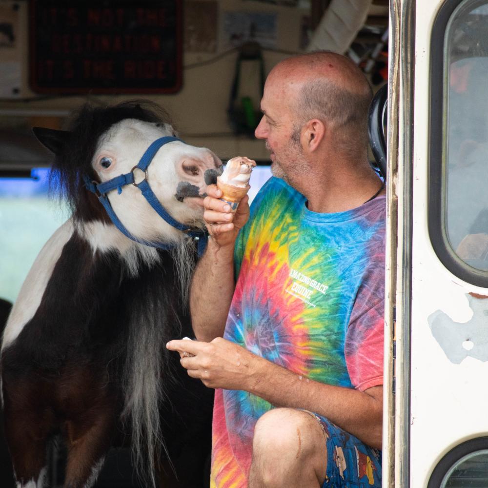 Tonto, left, and Scott Lorraine enjoy soft serve ice cream in Mattapoisett last July. Photo by Sawyer Smook-Pollitt